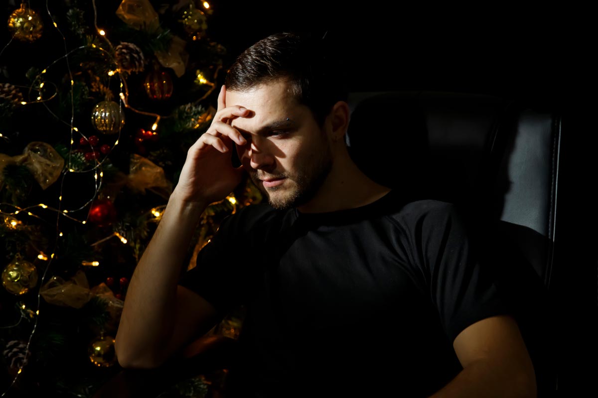 man struggling with new years blues