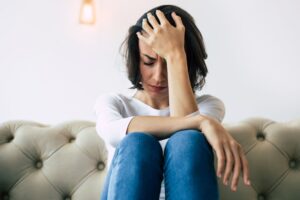 woman struggling with dysthymia vs generalized anxiety disorder