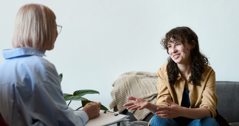 woman smiling speaking with her therapist in atlanta about how EMDR for Mental Health is helping her