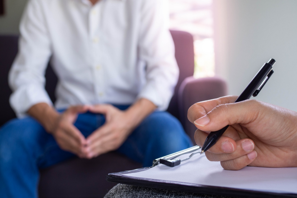 male patient speaking with his psychiatrist asking is prozac addictive