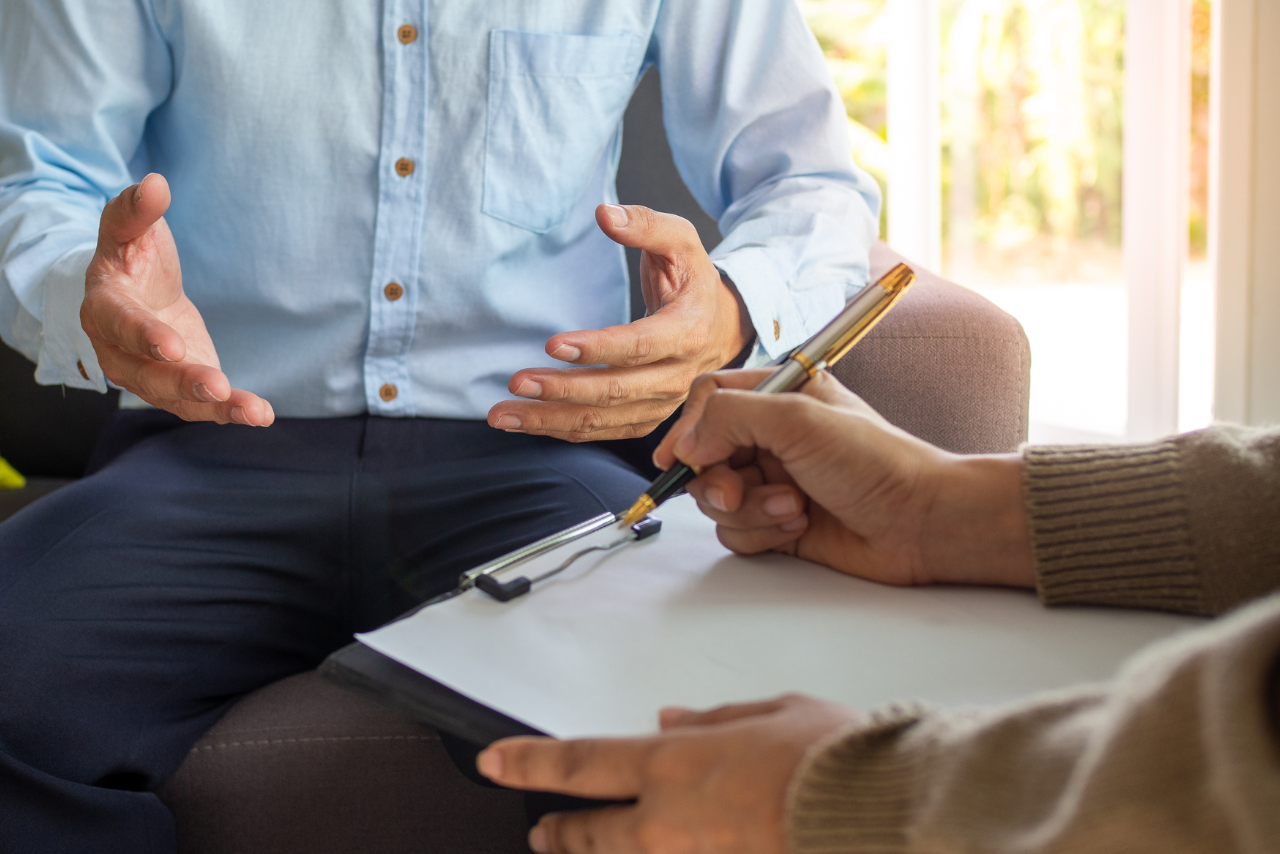 patient speaking with therapist about United Healthcare Mental Health Coverage