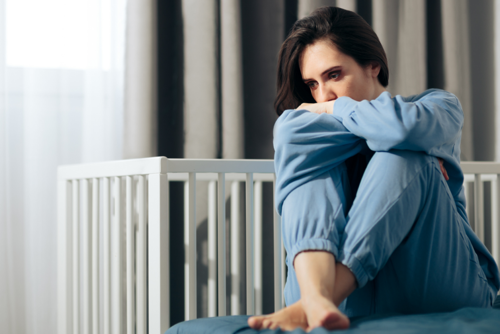 woman struggling with the question can you have postpartum depression after a miscarriage