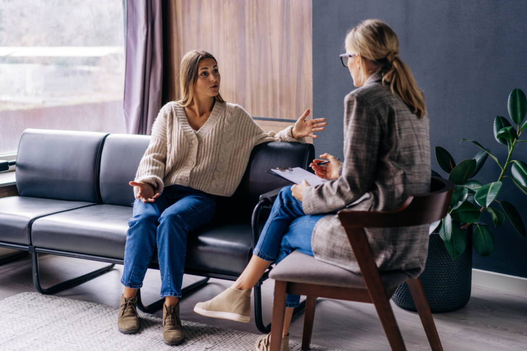 patient sitting with her therapist discussing inpatient vs outpatient mental health